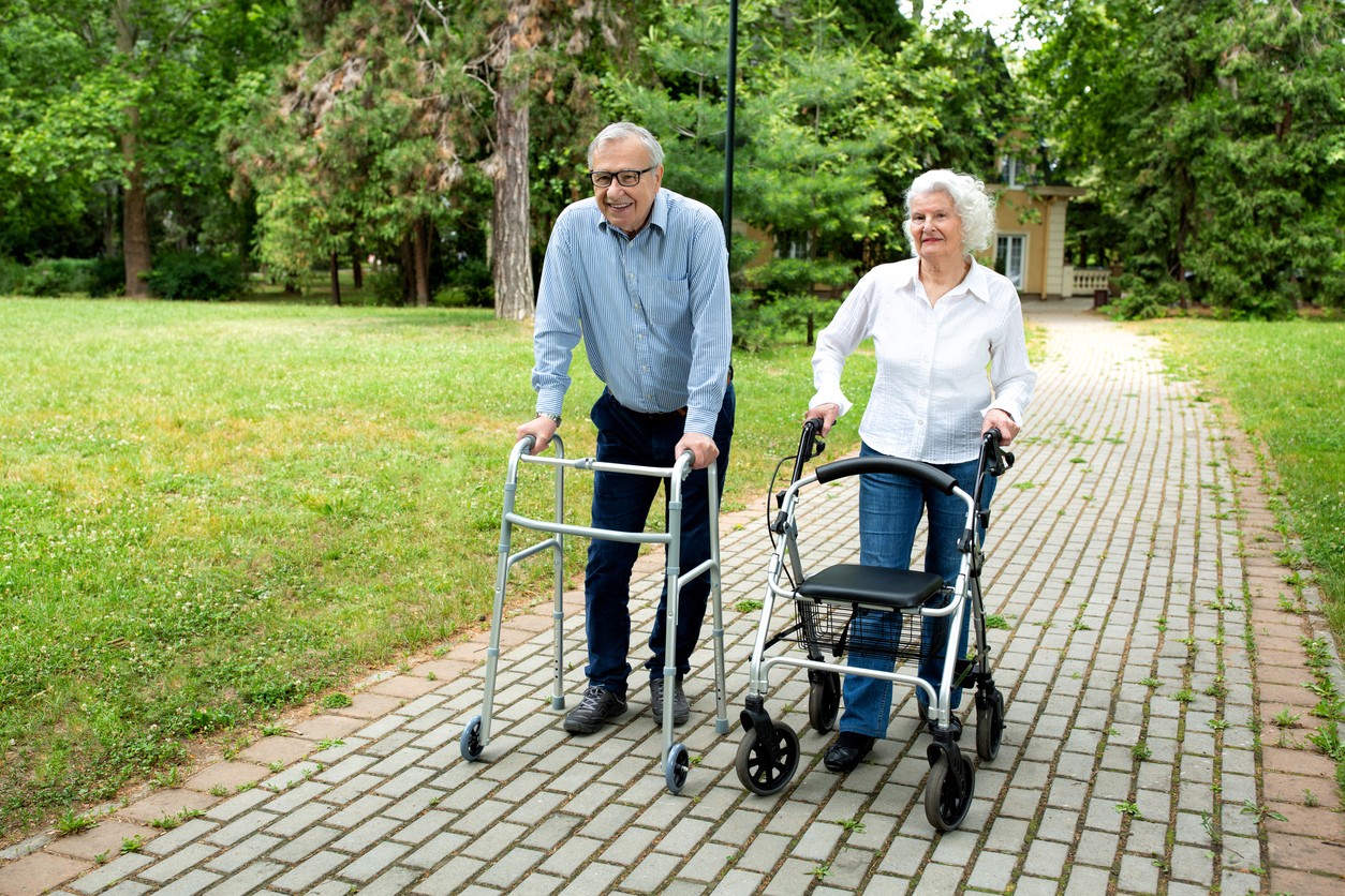 senior-couple-with-rolling-walkers